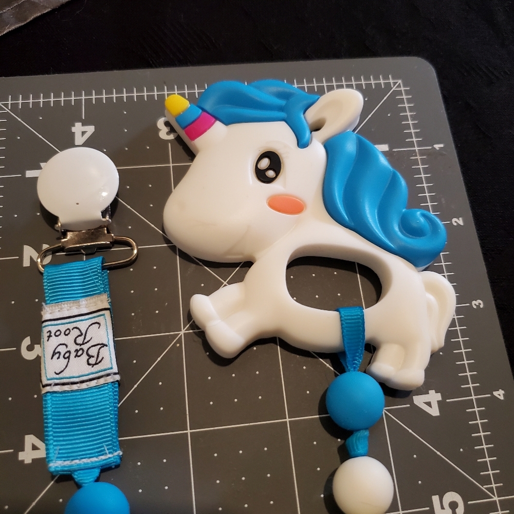 Baby Root Clip-On Unicorn Teether, white blue and yellow, not chewed